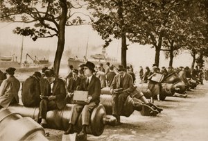 City workers lunch at Tower wharf, seated on old cannons by English Photographer